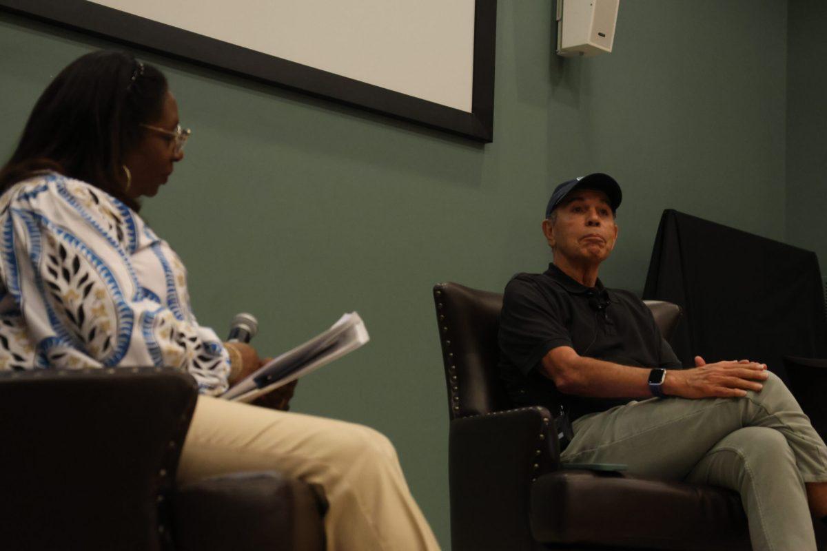 Dr. Woodard speaks to author Ron Collins about his book, "Tragedy on Trial:The Story of the Infamous Emmett Till Murder Trial." (Photo by Noah McLane)