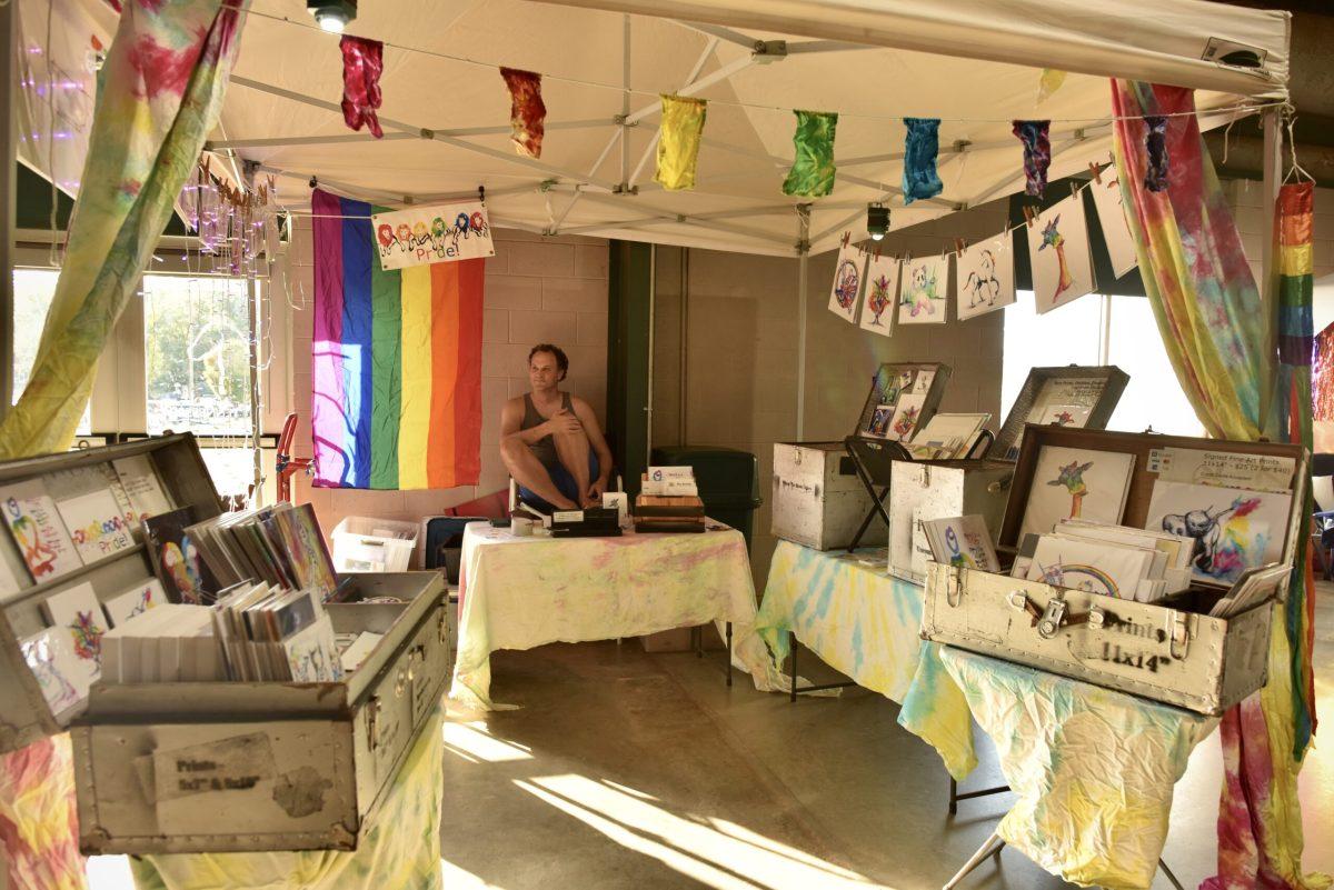 Ben Griffin relaxes at his booth at BoroPride in Murfreesboro, Tennessee, on Oct. 12, 2024. (Photo by Skyler Wendell)