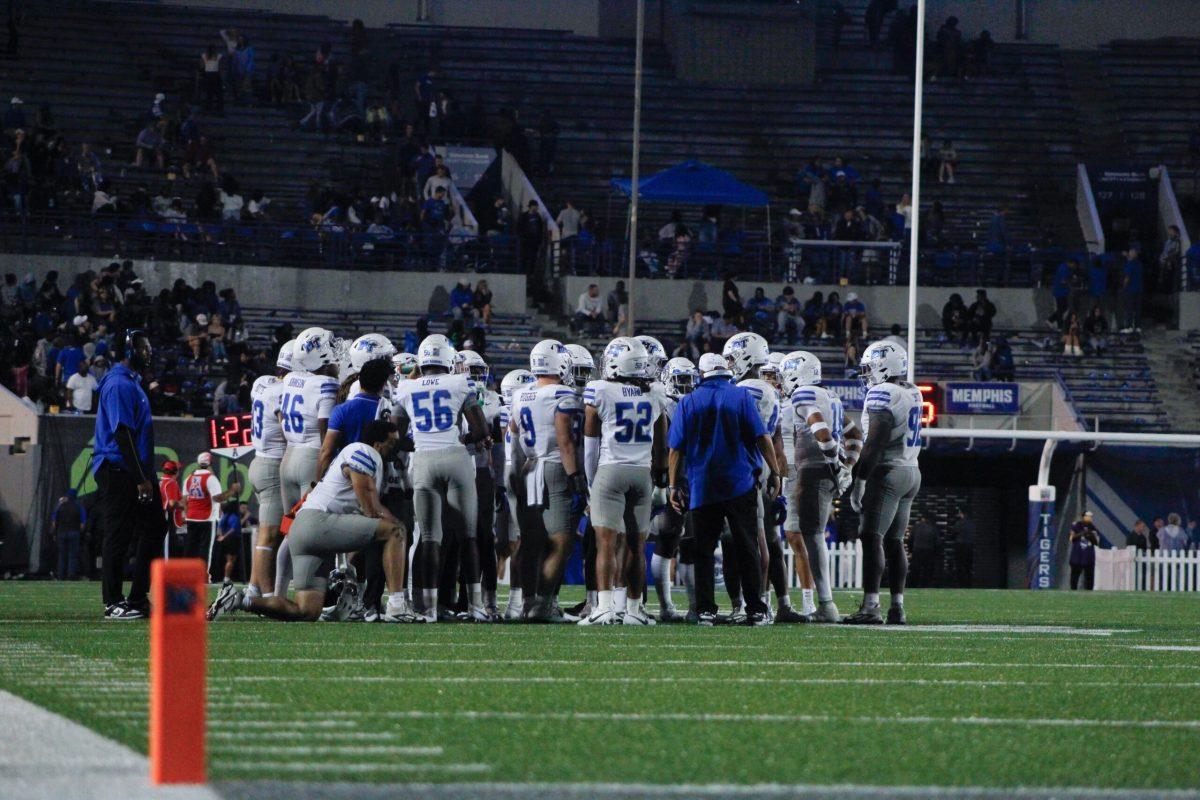 MTSU team huddle, 9-28-24. (Photo by Abby Barber)