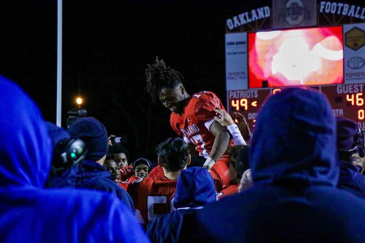 Oakland celebrates after a nail-biting win over Riverdale in the playoffs, 11-22-2024. (Photo by Ephraim Rodenbach)