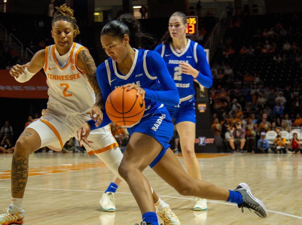 Ta'Mia Scott drives baseline against Ruby Whitehorn (2), 11-12-2024. 