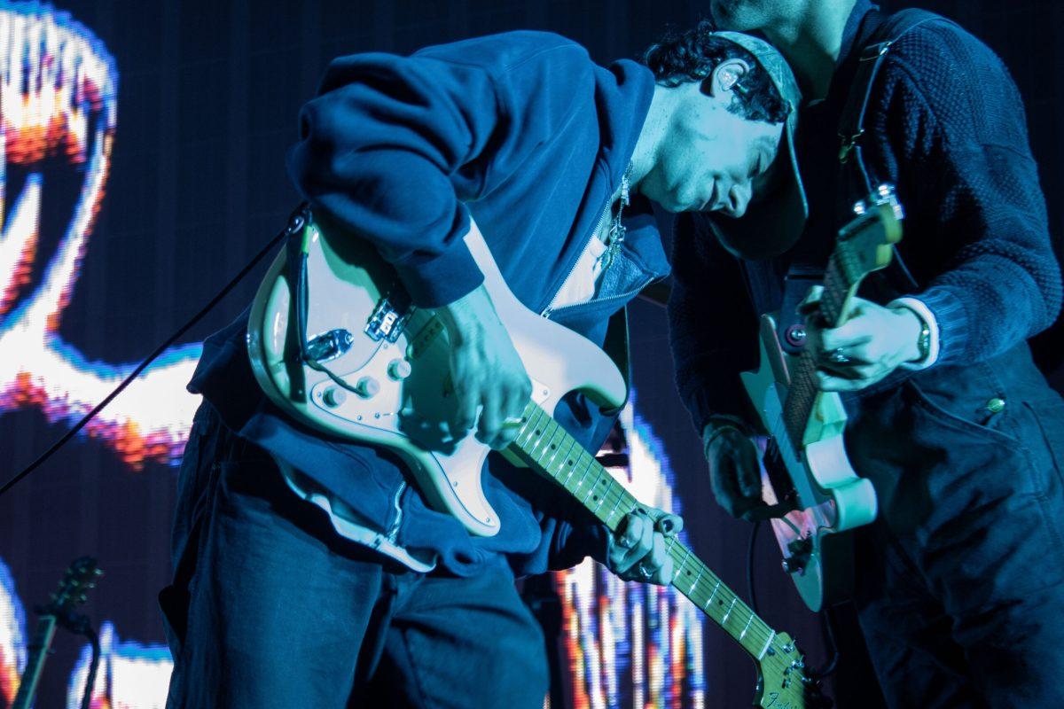 Del Water Gap leans on his guitarist while he strums his own guitar in Murfreesboro, Tennessee, on Nov. 13, 2024. 
