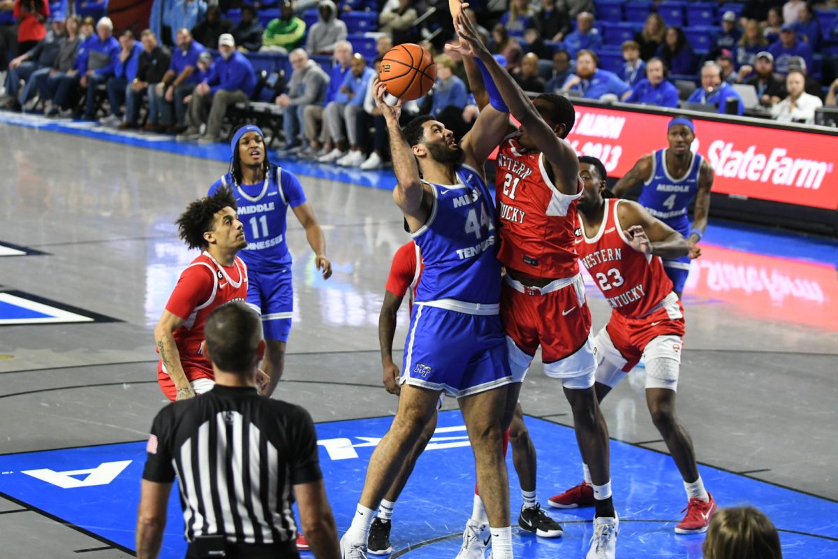 Essam Mostafa fights through a multitude of Hilltoppers for a layup in the Murphy Center on Jan. 18, 2025. 