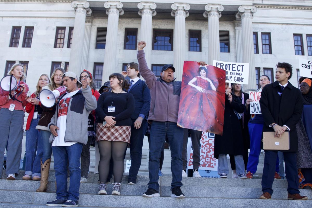 A relative of Josselin Corea Escalante, the student killed in the Antioch High School shooting, speaks into a megaphone on the capitol steps in Nashville, Tennessee on Jan. 27, 2025.