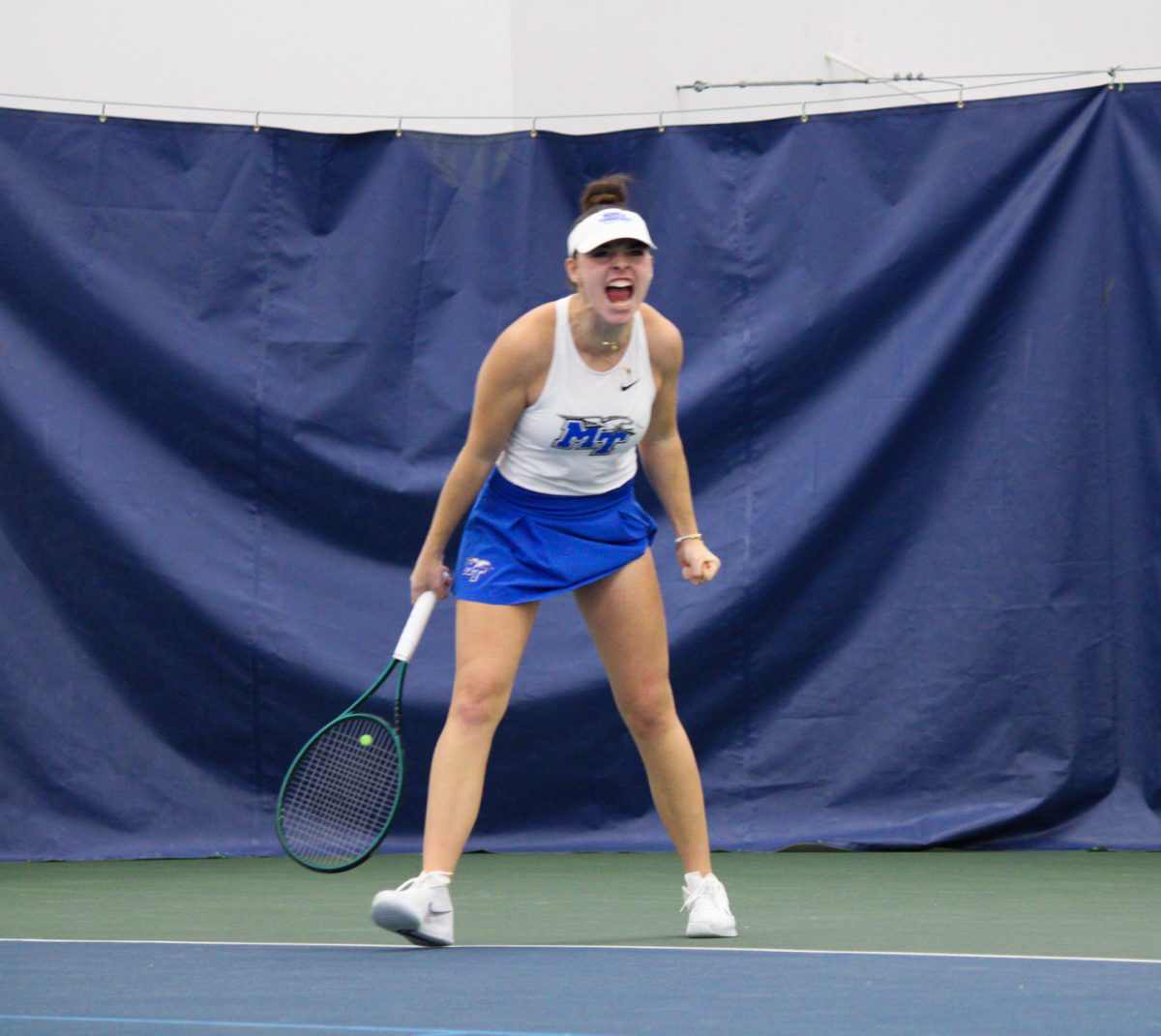 Lena Peyer celebrates a point against Louisville at the Adams Tennis Complex on Jan. 24, 2025.