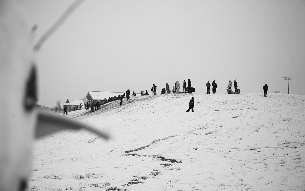 Sledders trudge up a hill for another round in Murfreesboro, Tennessee, on Jan. 10, 2025.