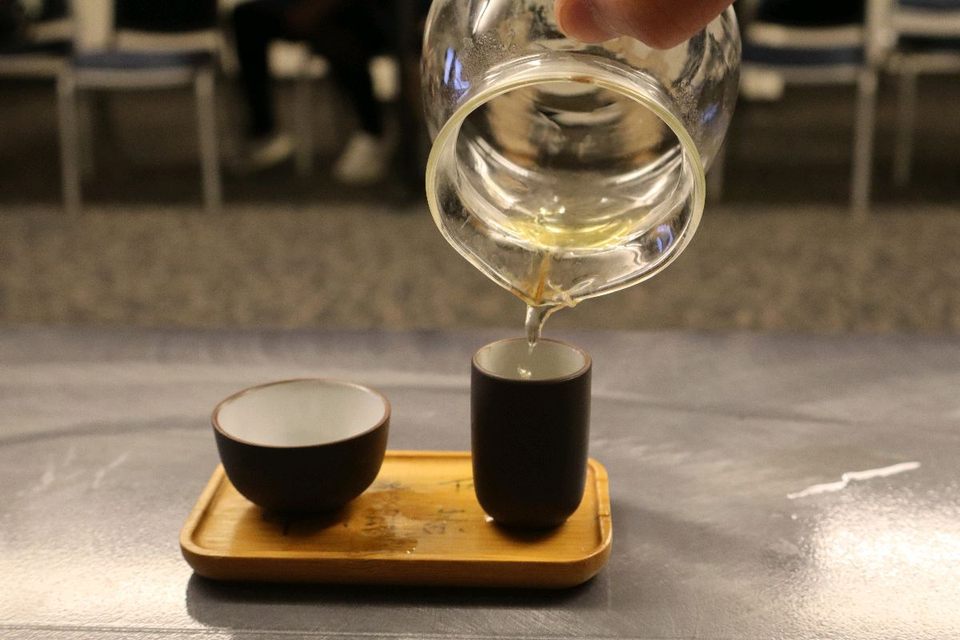 Green tea is poured into a traditional tea set at Tea Meets Kettle at MTSU in Murfreesboro, Tennessee, on Feb. 27, 2025.