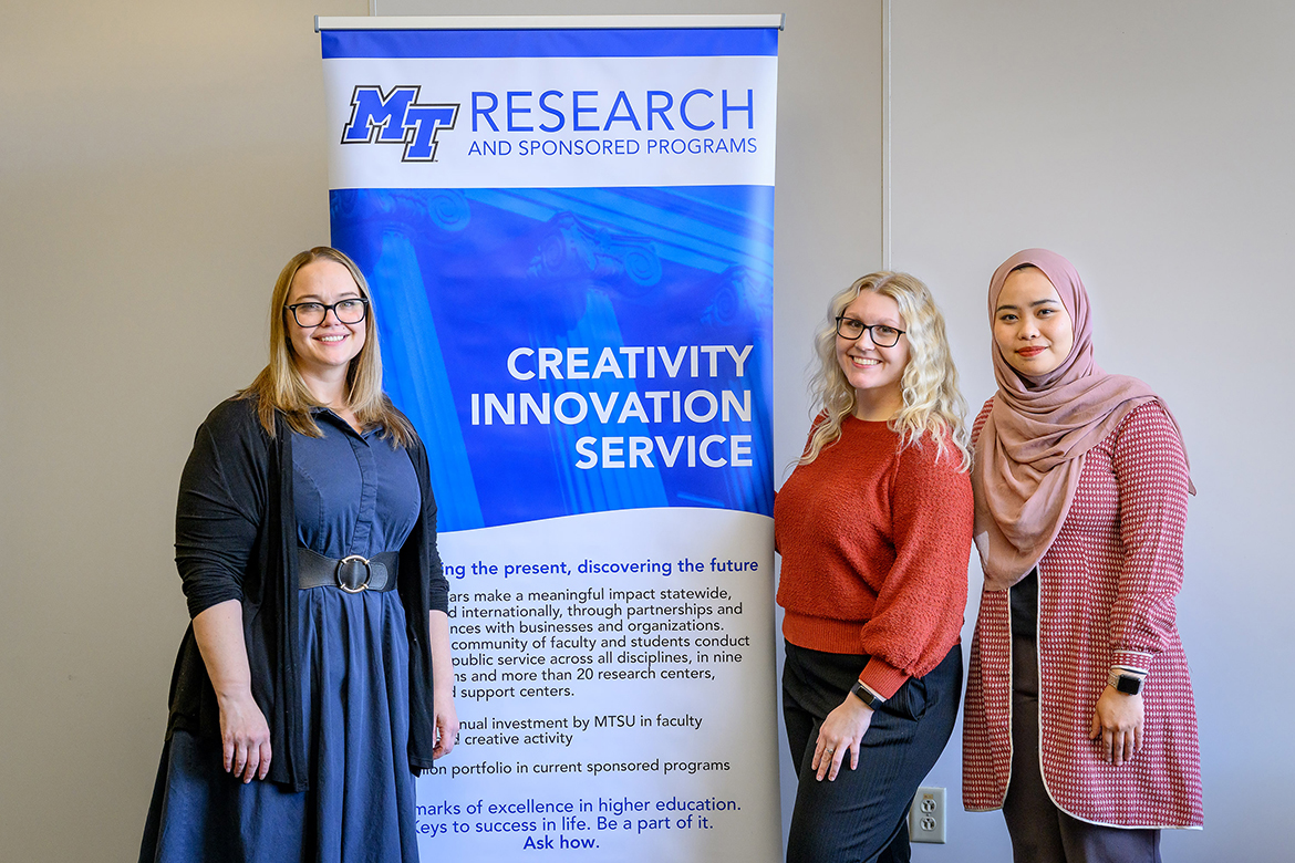 In the Middle Tennessee State University Science Building on campus in Murfreesboro, Tenn., award-winning researcher and biology assistant professor M. Elizabeth Barnes, left, graduate student Alexa Summersill and doctoral student Rahmi Aini had their findings from a nationwide survey of college biology students regarding conflict-reducing practices in evolution education published by peer-reviewed PLOS One, a science journal from the San Francisco, Calif.-based Public Library of Science, or PLOS. (MTSU photo by J. Intintoli)