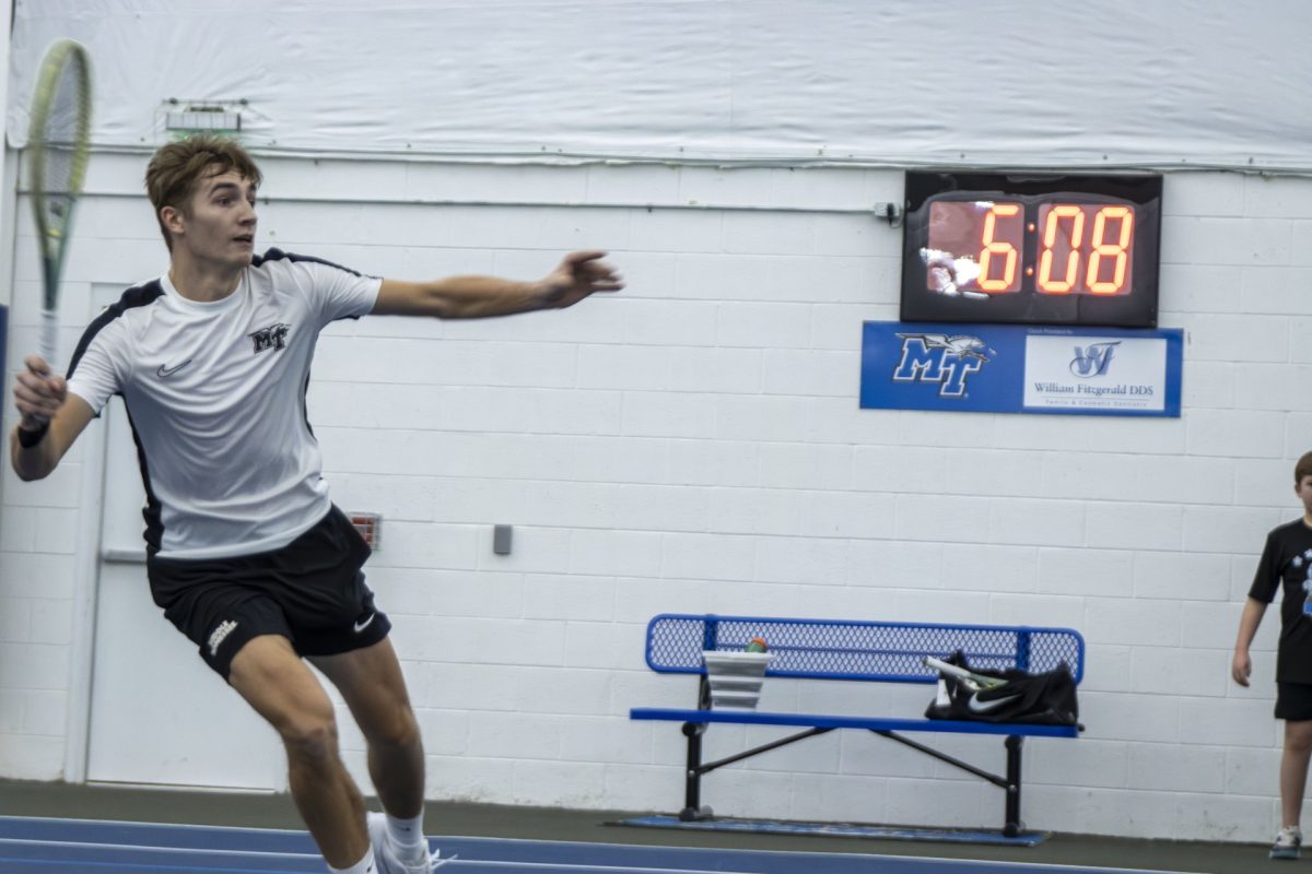 Kacper Szymkowiak returns a ball against Vanderbilt on Feb. 5, 2025 at the Adams Tennis Complex.