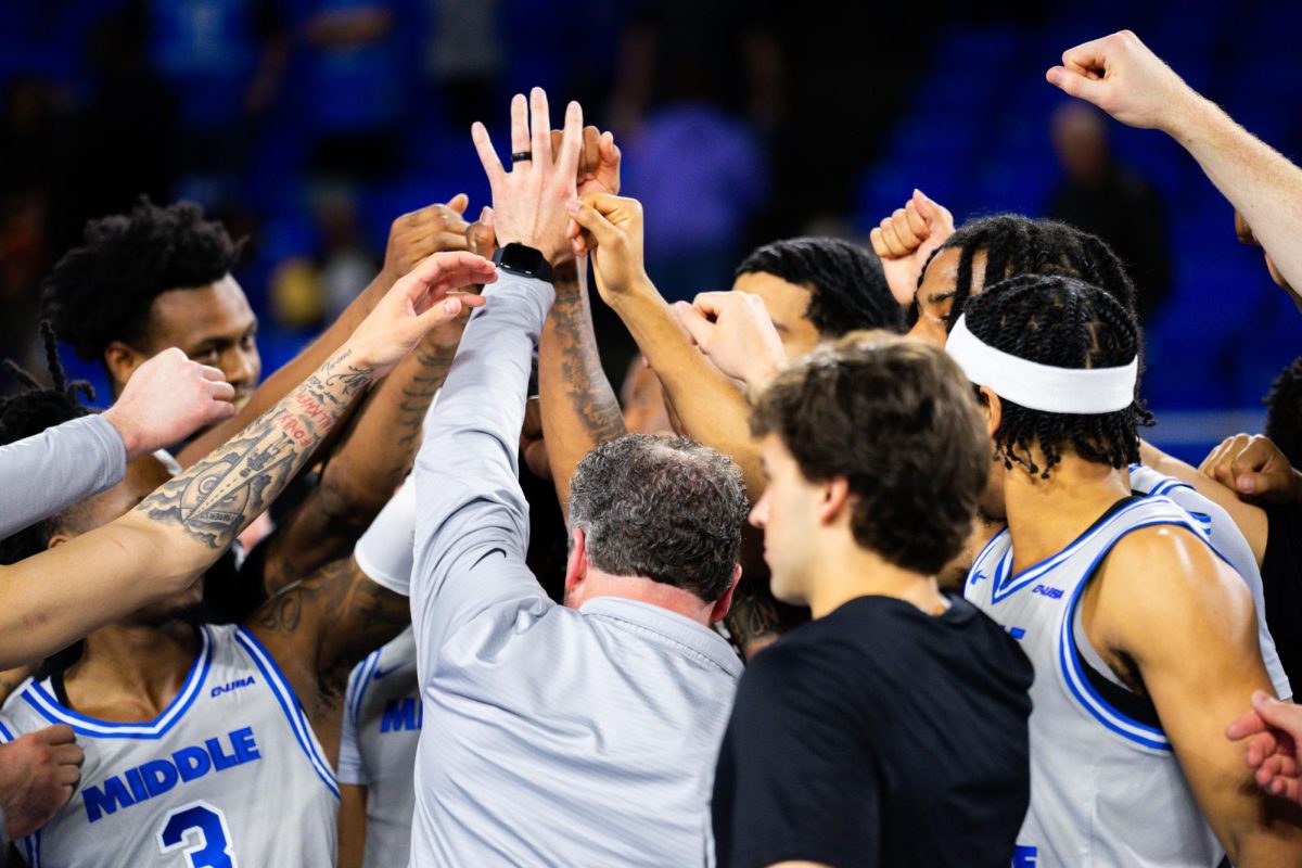 Head coach Nick Mcdevitt breaks down the huddle with his team prior to tip-off against UTEP in the Murphy Center on Feb. 1, 2025.