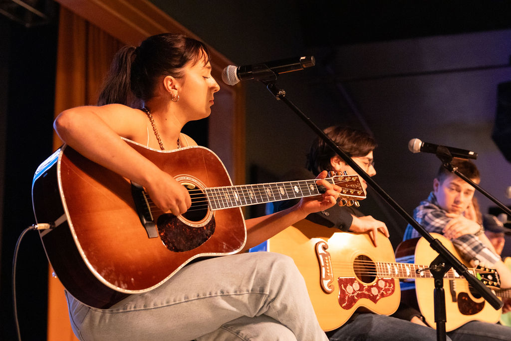 Singer-songwriters onstage at "Blue Bloods in the Round" in Shelbyville, Tennessee, on Feb. 13, 2025.