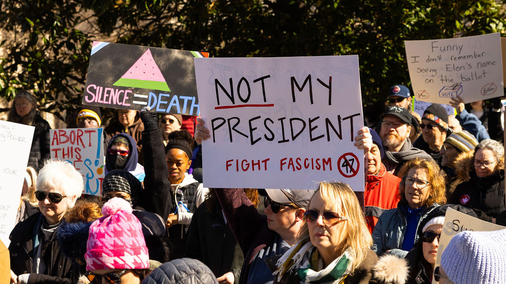  Protestors Hold Up Signs on the footsteps of the capital in Nashville, Tennessee, on February, 17th 2025.