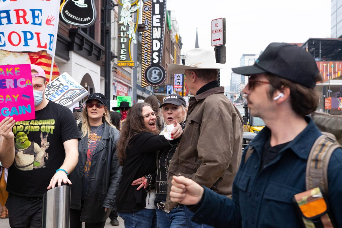 Protester hugs woman yelling at crowd in Nashville, Tennessee, on Feb. 5, 2025.