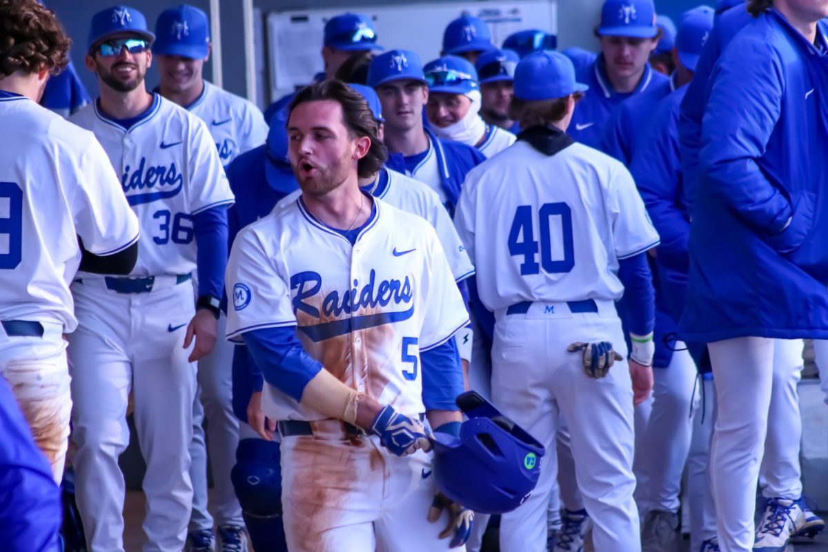 Redshirt sophomore Matt Wolfe takes a stroll through the dugout after an at-bat against Bowling Green at Reese Smith Jr. Field on Feb. 14, 2025.