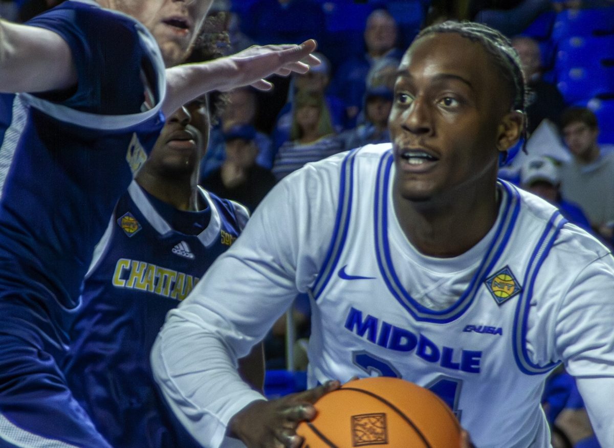 Camryn Weston dribbles under the basket against Chattanooga at Murphy Center on March 18, 2-25.