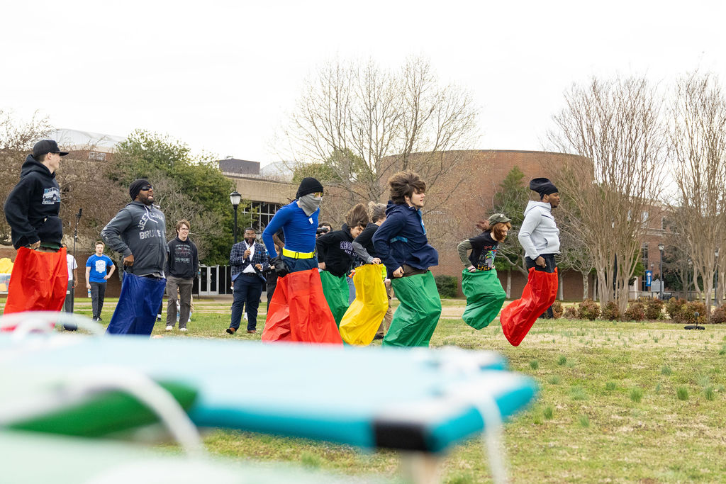 "Go! Go! Gameshow" participants hop across the KUC field at MTSU in Murfreesboro, Tennessee, on March 16, 2025.