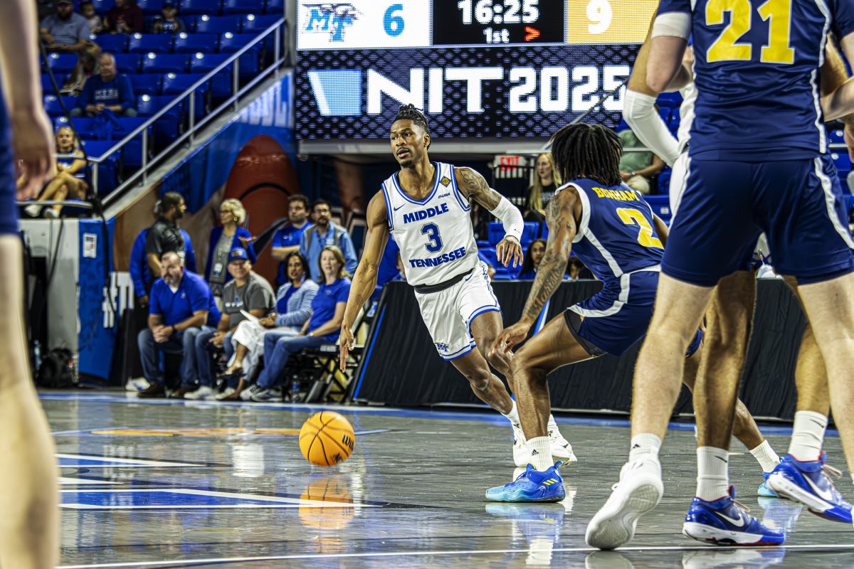 Jestin Porter dribbles at mid-court court against Chattanooga at Murphy Center on March 18, 2025.