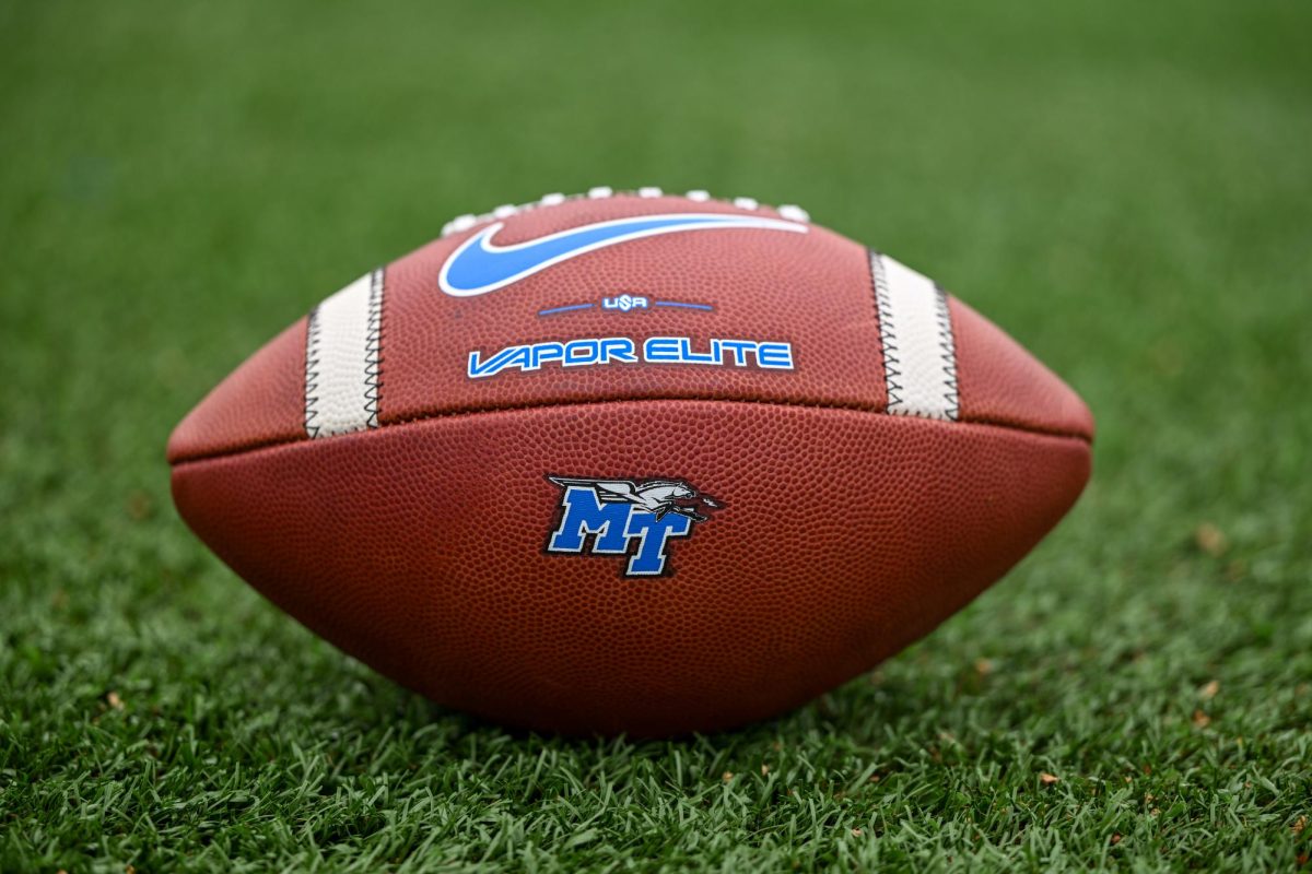 An MTSU team issued football rests on the turf during a fall camp practice at Floyd Stadium on Aug. 5, 2025.