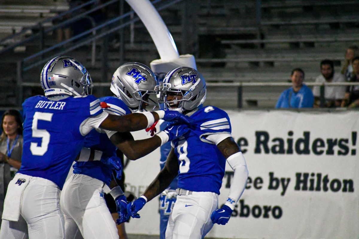 MTSU recievers including Amorion Walker (8) and Myles Butler (5) celebrate in the endzone after a score against Marshall, at Floyd Stadium on Sept. 20, 2025.