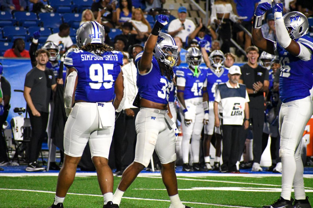 MTSU's Muaaz Byard (35) signals a stop for the Blue Raider defense alongside Zeion Simpson-Smith (95) and Jaiyden Thompson (16) against Marshall, at Floyd Stadium on Sept. 20, 2025.