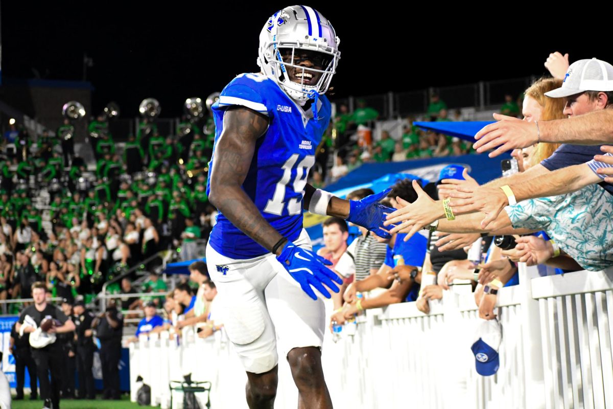 MTSU's Kason Stokes greets fans during a game against Marshall, at Floyd Stadium on Sept. 20, 2025.