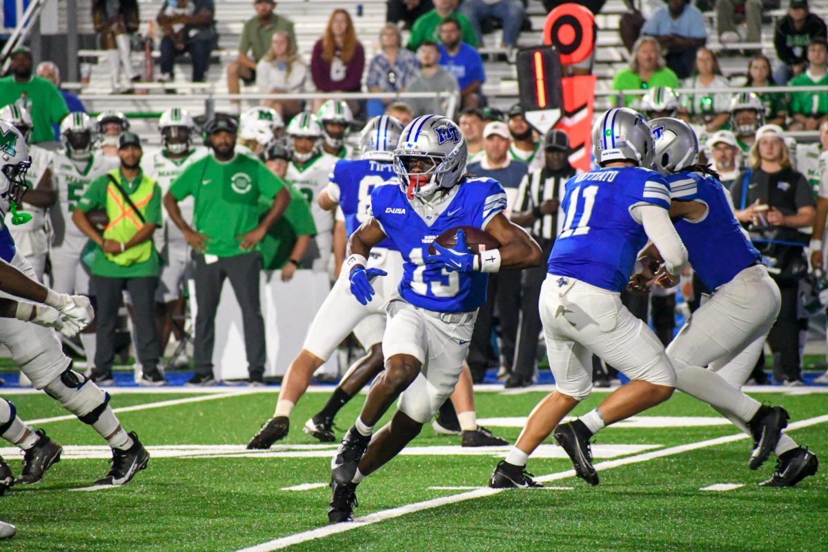MTSU's Cam'ron Lacy looks for open space in the backfield against Marshall, at Floyd Stadium on Sept. 20, 2025.