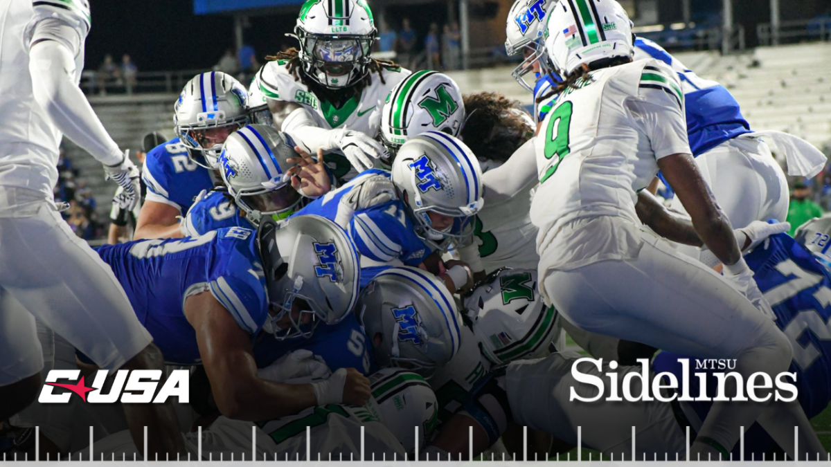 MTSU's offensive line pushes quarterback Nick Vattiato over the goal line in a game against Marshall at Floyd Stadium on Sept. 20, 2025.