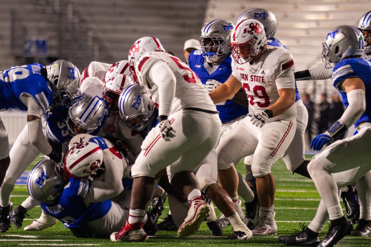 MTSU's defense swarms Jax State running back Cam Cook in a game at Floyd Stadium on Oct. 29, 2025.