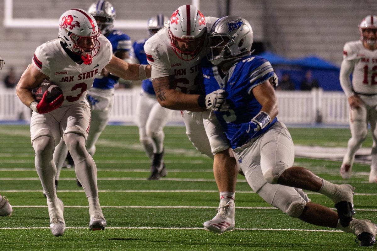 MTSU linebacker Alex Mitchell attempts to make a tackle in a game against Jax State at Floyd Stadium on Oct. 29, 2025.