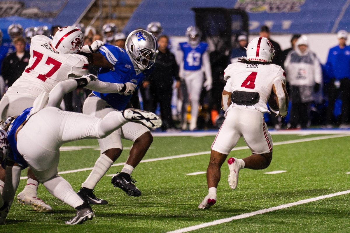 MTSU's defensive line crashes down on running back Cam Cook in a game against Jax State at Floyd Stadium on Oct. 29, 2025.