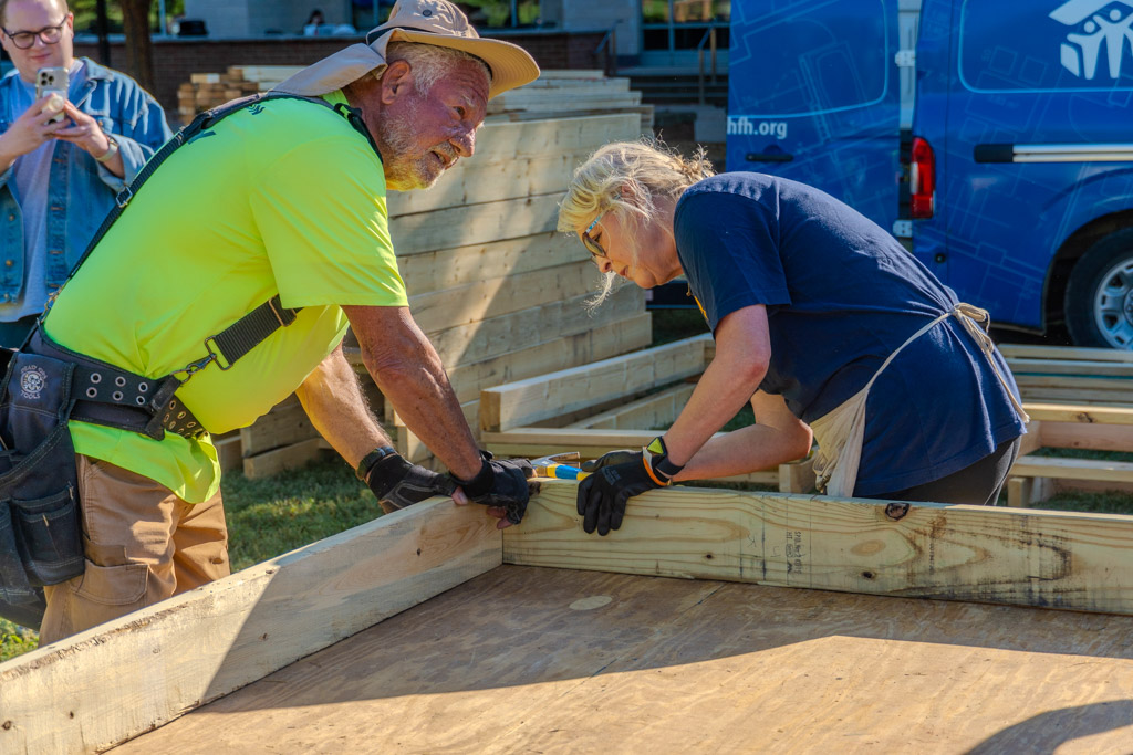 A woman assists Habitat for Humanity in building a small home at MTSU in
Murfreesboro, Tennessee on Oct. 2, 2025.