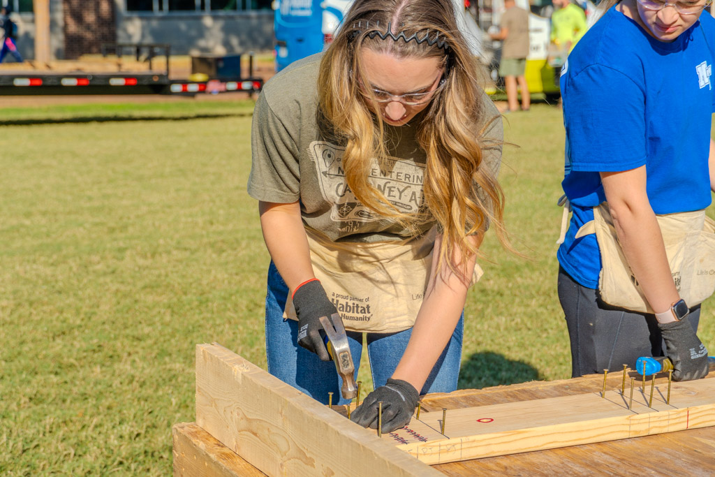 A student assists Habitat for Humanity in building a small home at MTSU in
Murfreesboro, Tennessee on Oct. 2, 2025.