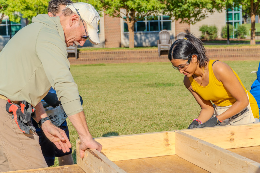 A student assists Habitat for Humanity in building a small home at MTSU in
Murfreesboro, Tennessee on Oct. 2, 2025.