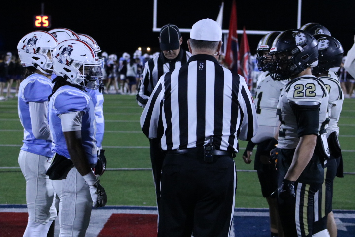 Oakland High School and Bradley Central High School's captains meet before the coin toss, at Ray Hughes Stadium on Nov. 14, 2025.