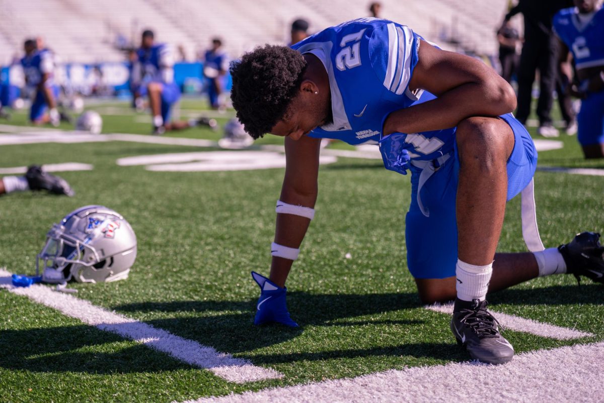 MTSU's Abdul Muhammad stretches ahead of a game against FIU at Floyd Stadium on Nov. 8, 2025.