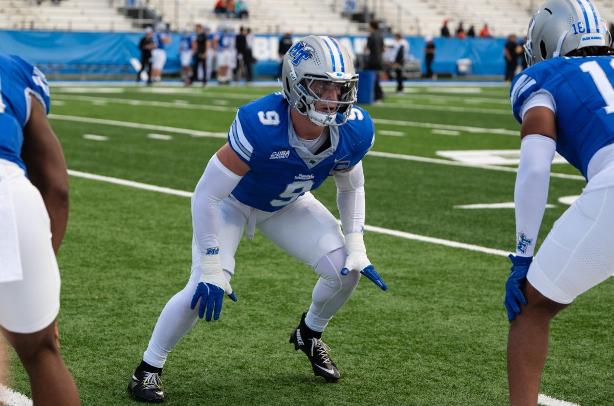 MTSU linebacker Parker Hughes prepares to collide with a teammate during warmups, prior to a game against Sam Houston in Floyd Stadium on Nov. 22, 2025.