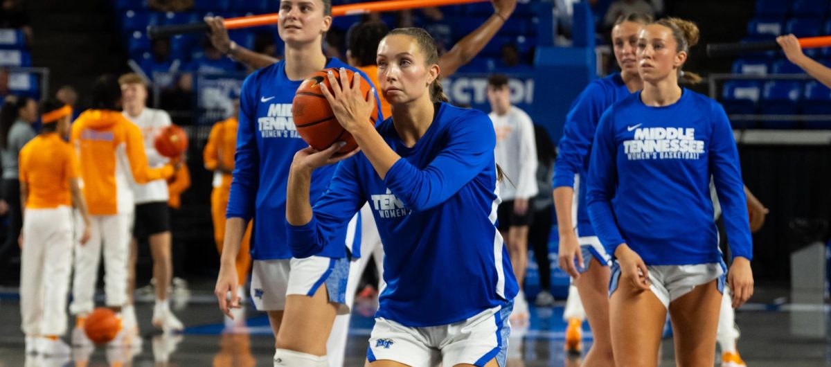 MTSU's Blair Baugus shoots a three-pointer during warm-ups against No. 15 Tennessee, at the Murphy Center on Nov. 20, 2025.