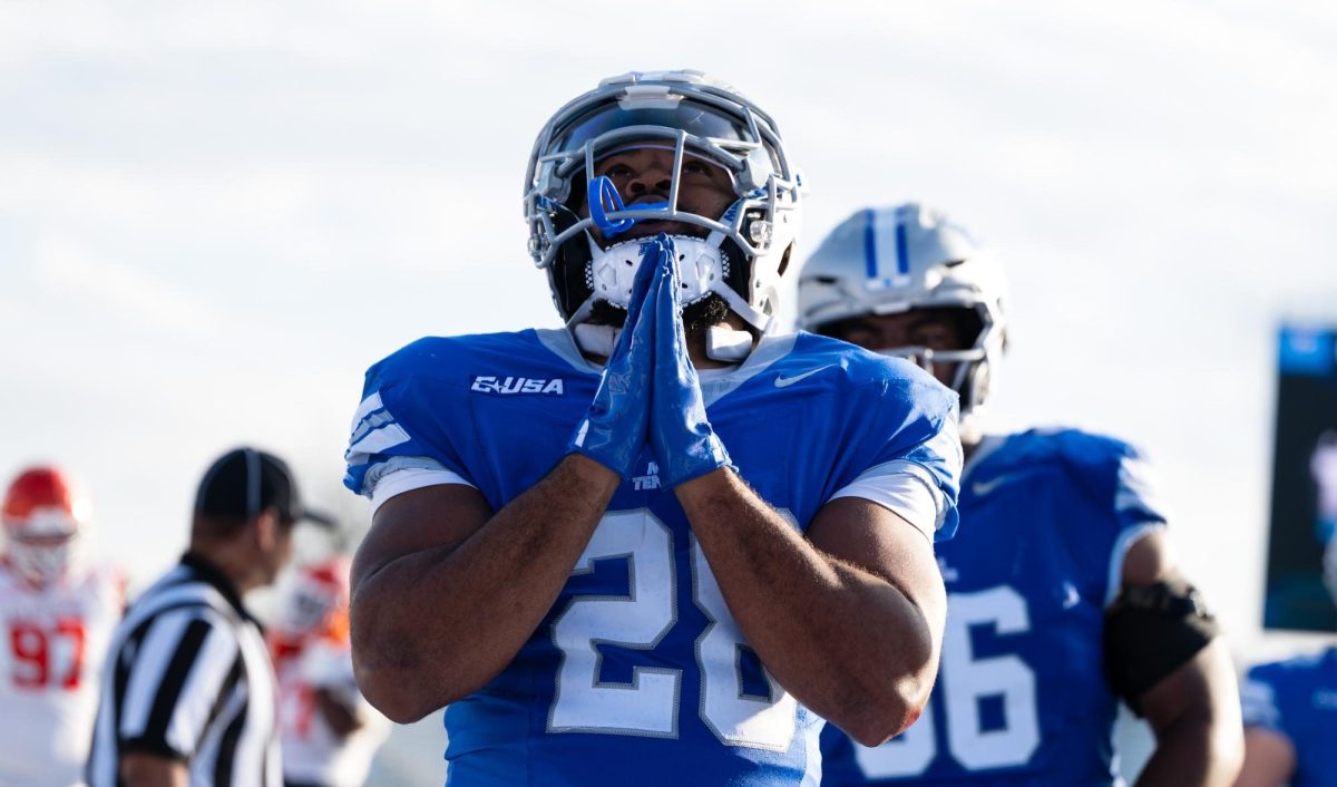 MTSU running back Rickey Hunt makes a prayer gesture after a one-yard touchdown against Sam Houston, at Floyd Stadium on Nov. 22, 2025.