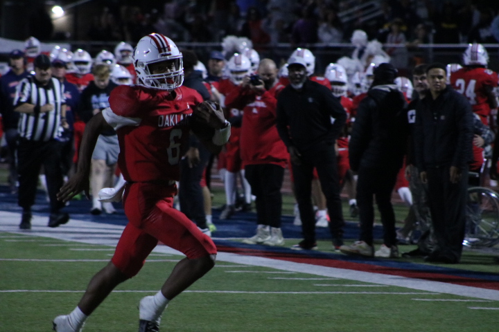 Oakland's Donte Cameron breaks away from the defense during a game against Green Hill High School, at Ray Hughes Stadium, on Nov. 21, 2025.