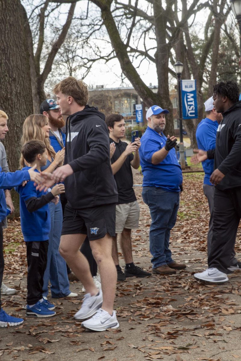 MTSU football's Parker Hughes (left) and Damonte Smith (right) greet fans at the final Raider Walk of the season at Walnut Grove on Nov. 22, 2025. 