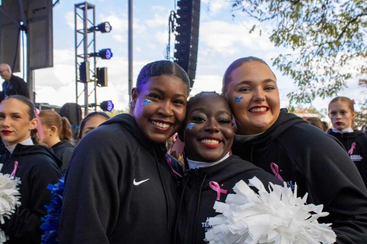 MTSU cheerleaders smile for a photo during the Party in the Grove at Walnut Grove on Oct. 29, 2025.
