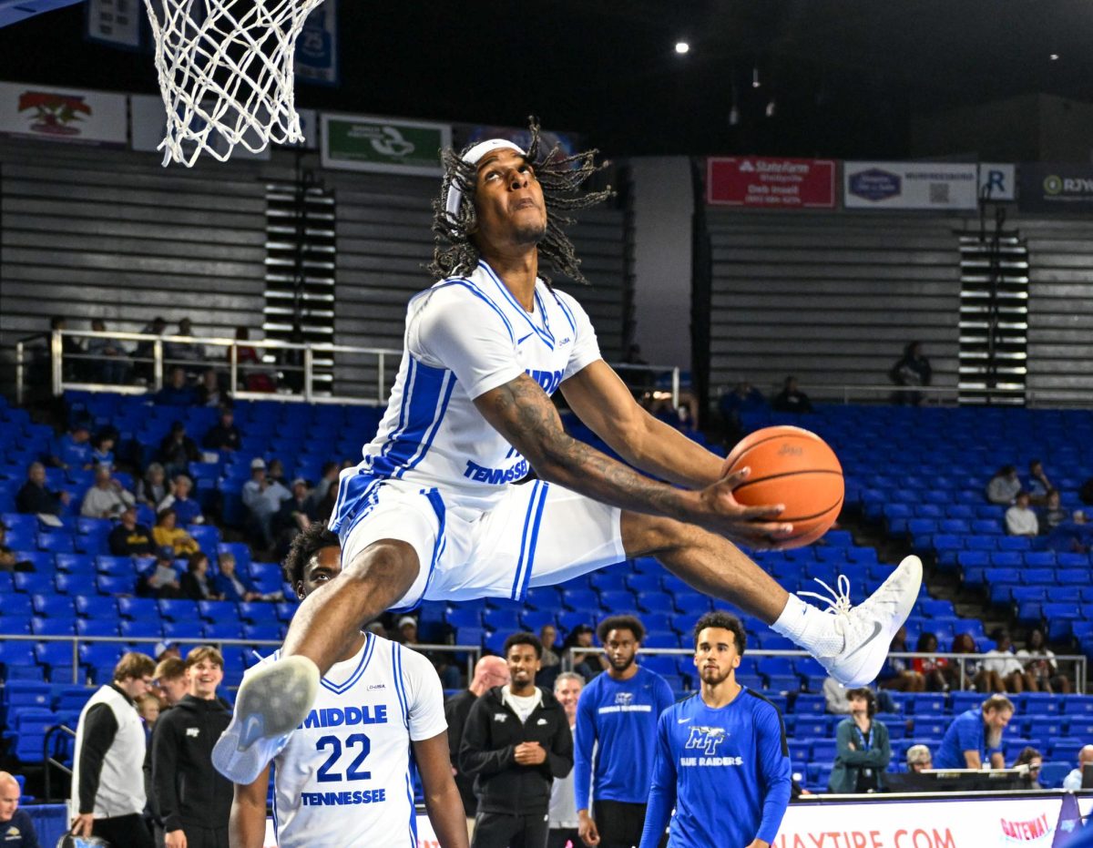 Tre Green throws down a dunk during pregame against Webster University, in the Murphy Center on Nov. 8, 2025.