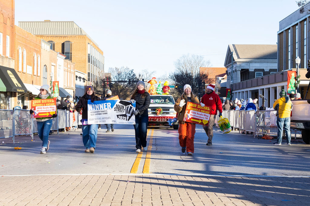 Four Sisters Antiques and Vintage float enters the Murfreesboro Square during the Murfreesboro Christmas Parade on E Main St. on Dec. 14, 2025 