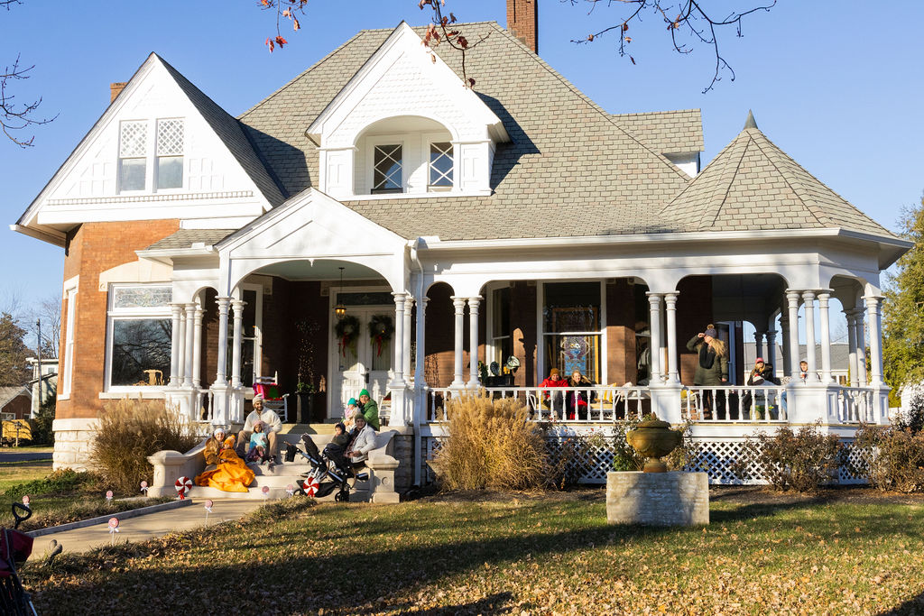 Families watch as the Murfreesboro Christmas Parade marches on E Main St. on Dec. 14, 2025 