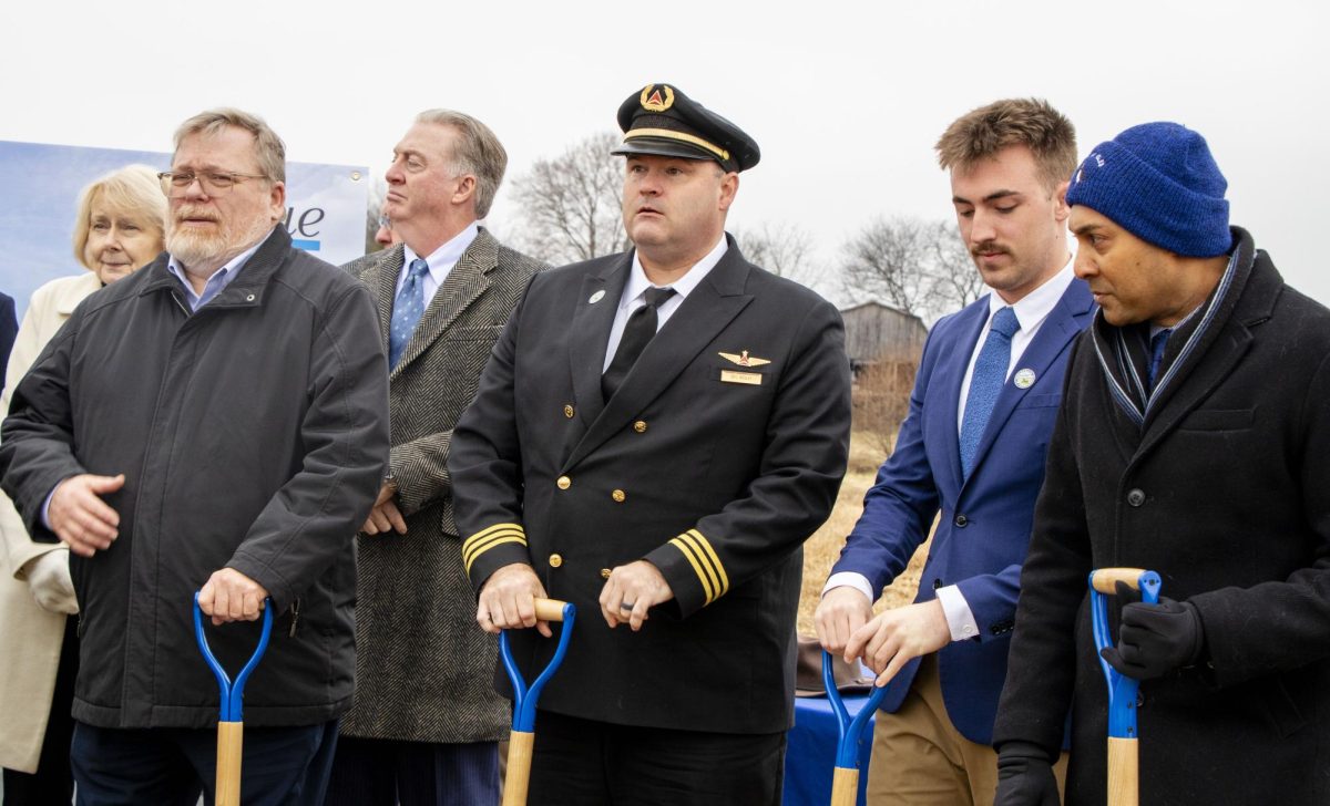 Graduates and MTSU community members stand ready to "break ground" at the Shelbyville Municipal Airport on Dec. 2, 2025.