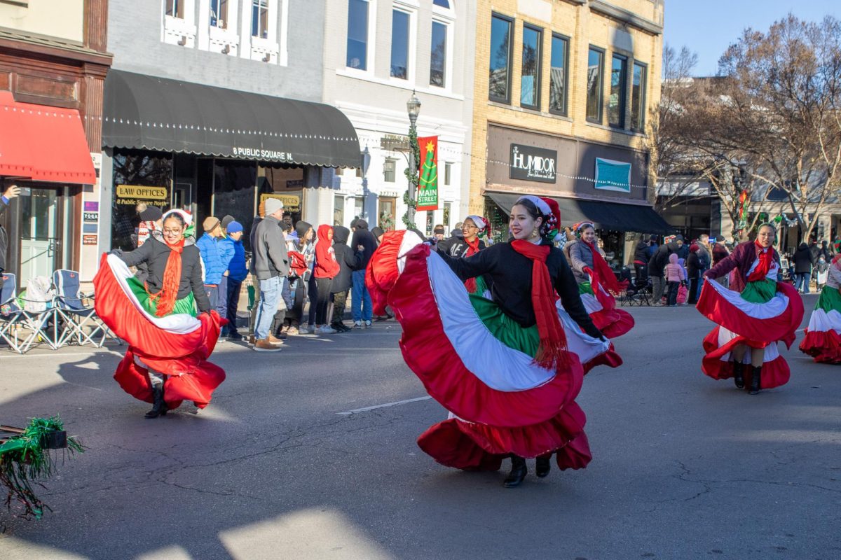 Traditional dancers in the Christmas Parade on Dec. 14, 2025.