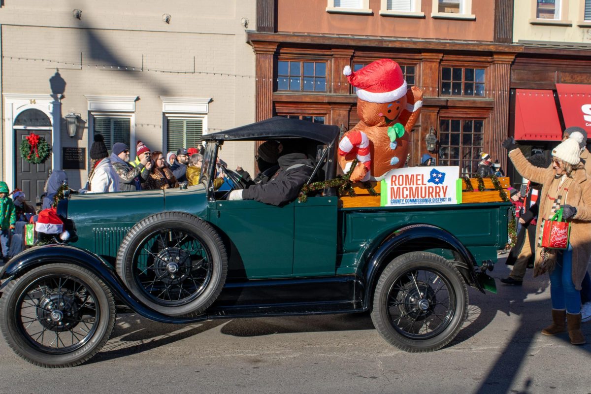 An antique car decorated for the parade on Dec. 14, 2025.