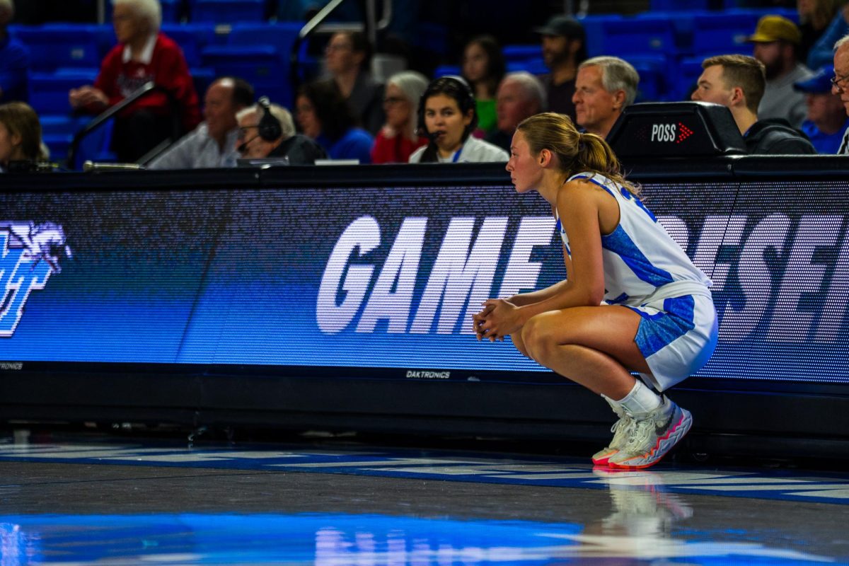 MTSU's Macie Phifer crouches in front of the scorer's table waiting to check in during a game against Belmont, at the Murphy Center on Dec. 3, 2025.