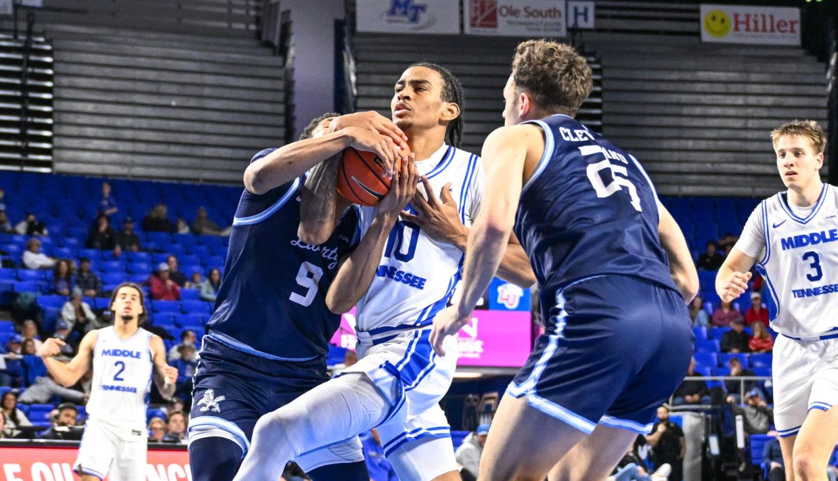 MTSU forward Torey Alston fights through contact in the paint during a game against Liberty, inside the Murphy Center on Jan. 29, 2026.
