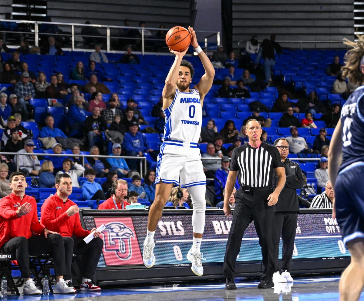 MTSU guard Alec Oglesby fires a three pointer from the corner during a game against Liberty, inside the Murphy Center on Jan. 29, 2026.